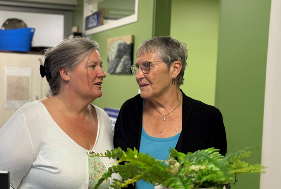 Man holding hands with child